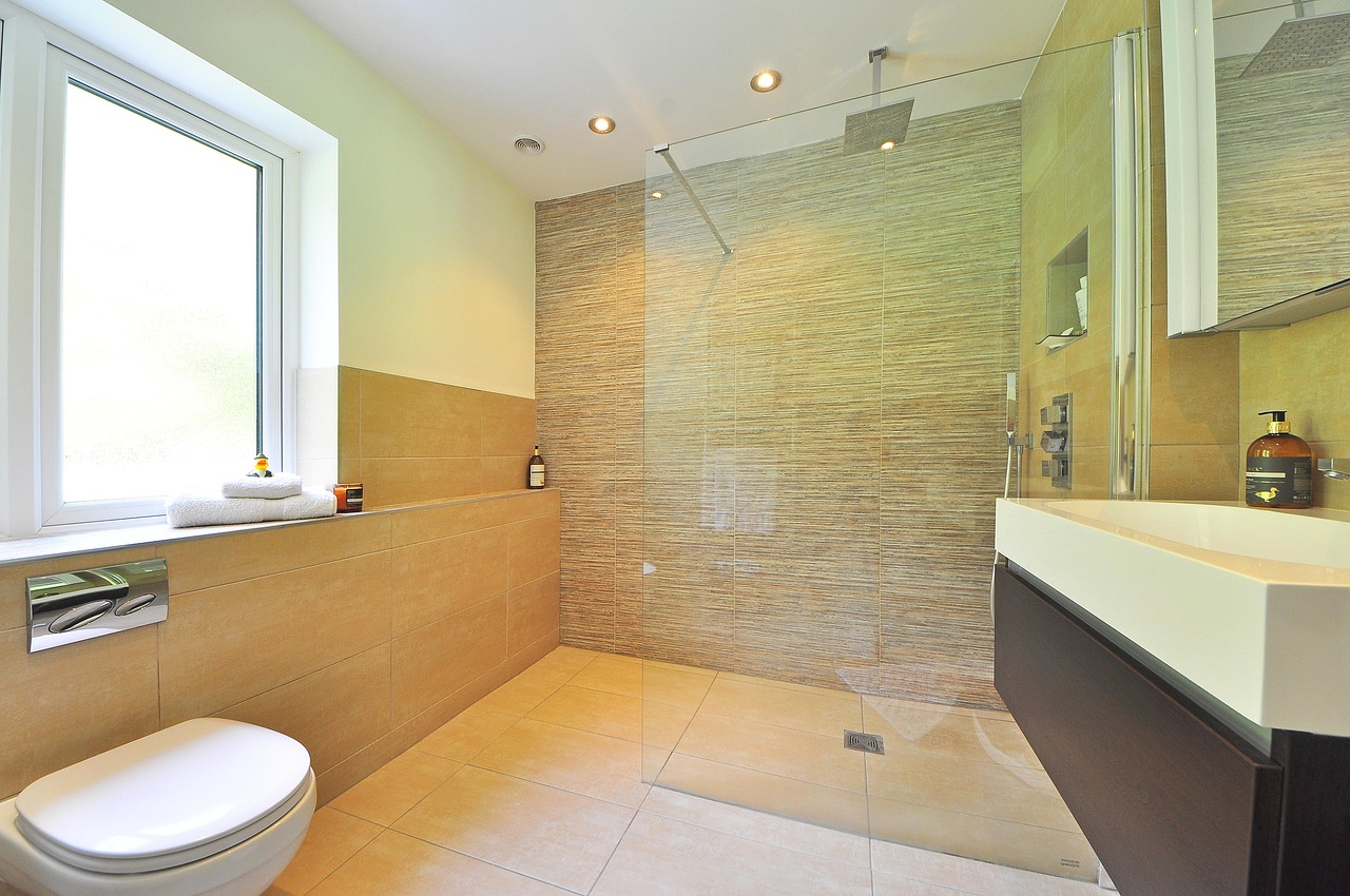 Modern guest bathroom remodel in Culver City, California, featuring a floating vanity and geometric accent tiles.