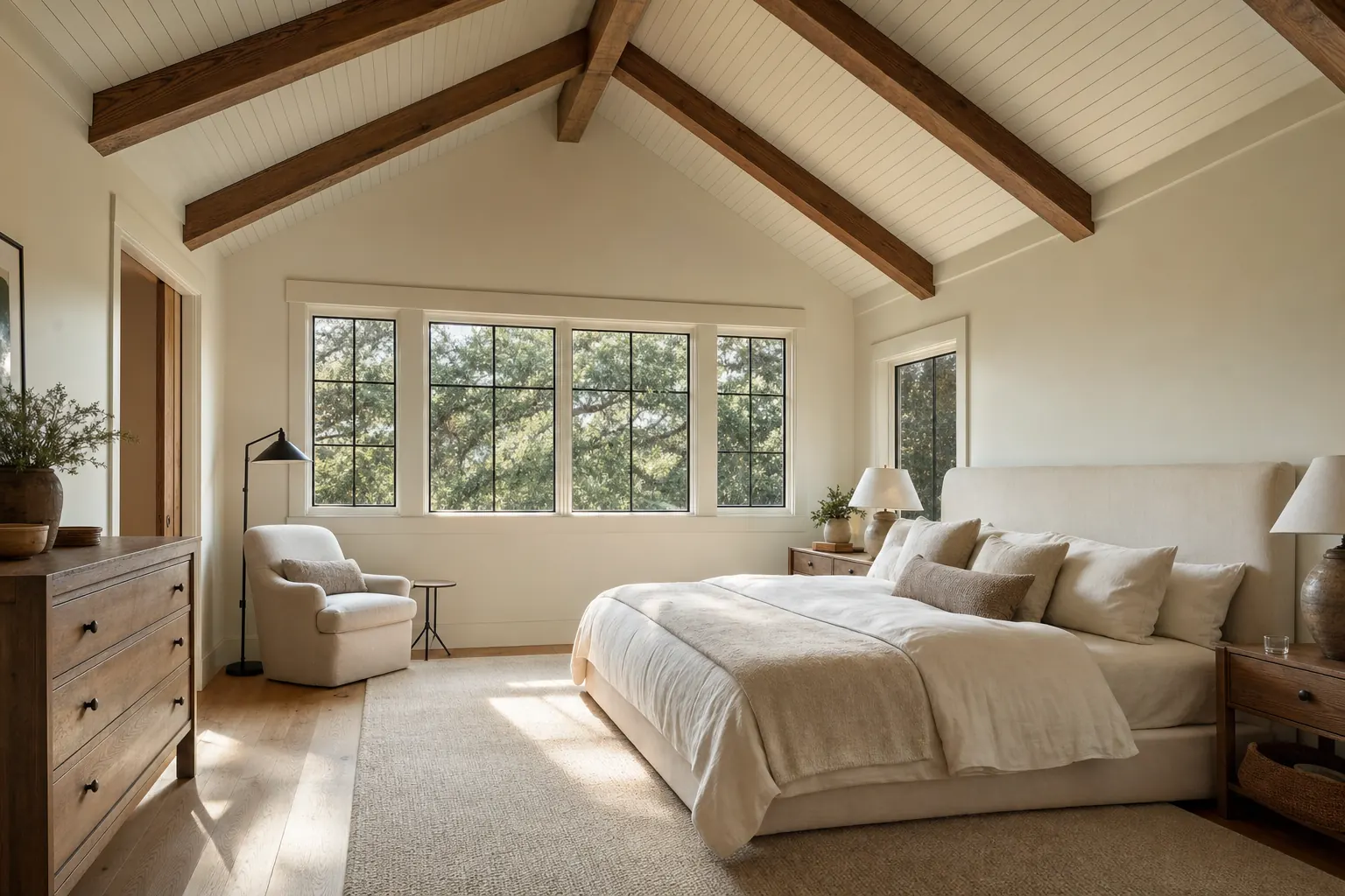 Vaulted primary bedroom in a second-story addition with exposed beams and tree-canopy views (design concept rendering)